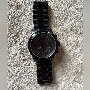 Michael Kors watch. Small scratch on front glass and needs new battery.